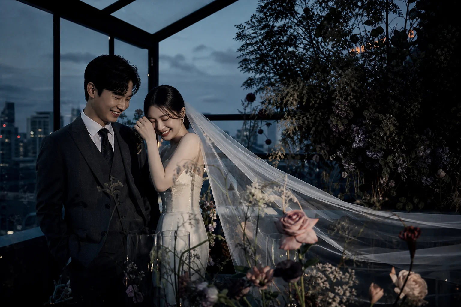 Couple in a glass rooftop greenhouse